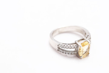 Yellow gem stone on diamond ring