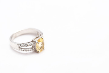 Yellow gem stone on diamond ring