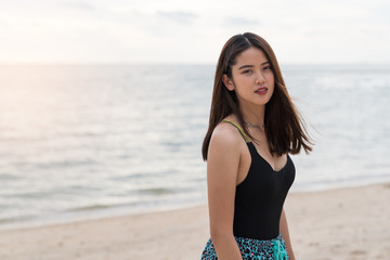 Fototapeta na wymiar Asian beautiful woman enjoyful on the beach background.