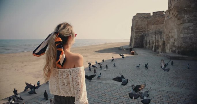 Young woman tourist walking and doing sightseeing in Europe