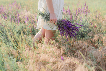 A bouquet of lavender flowers in girl's hands
