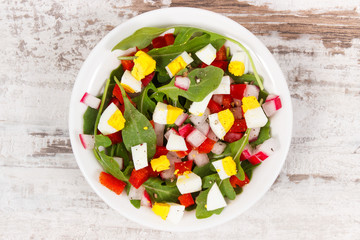 Fresh prepared salad in glass bowl, healthy nutrition concept