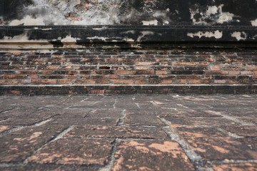 wall brick as a background in Wat Chaiwatthanaram, Ayutthaya Historical Park. Space for text in template. Black and orange brick of Temple.  