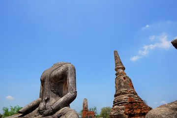Fototapeta na wymiar Travel Thailand - Pagoda in Wat Chaiwatthanaram on blue sky and cloud background, Ayutthaya Historical Park. The brick pagoda at old ayutthaya temple ruins. Space for text in template.