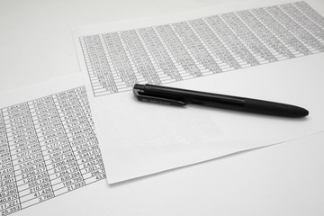 printout paper with pen on desk