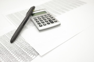 printout paper with calc and pen on desk