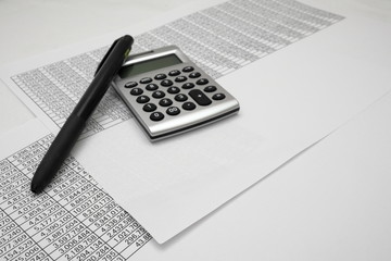printout paper with calc and pen on desk