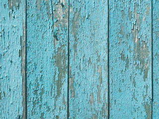 Fototapeta na wymiar shabby old flaky wooden background. blue damaged crackled paint. weathered worn out surface. copy space concept