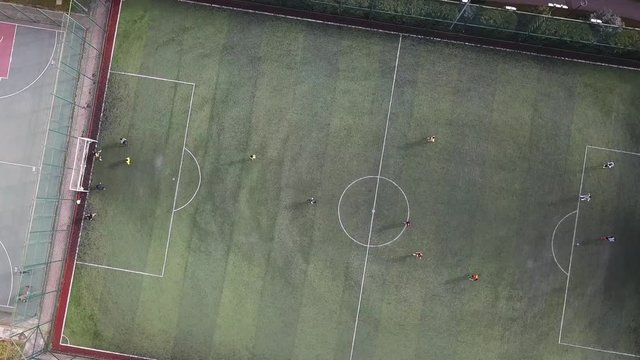 Aerial view of a Soccer Play on the grass football field