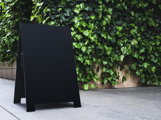 Blank Board stand mock up Black Signage Outdoor green garden background
