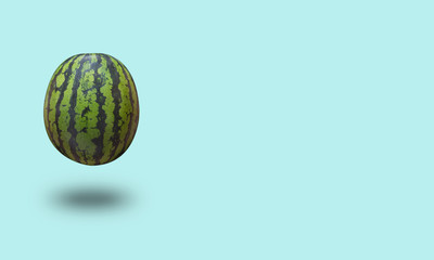 Watermelon isolated on a blue pastel background with a shadow