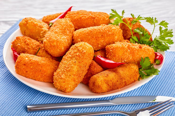 fried golden brown potato croquettes, close-up