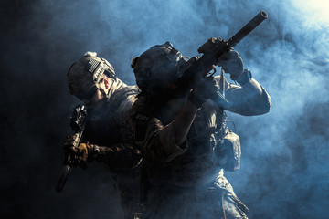 Group of security forces in Combat Uniforms with rifles