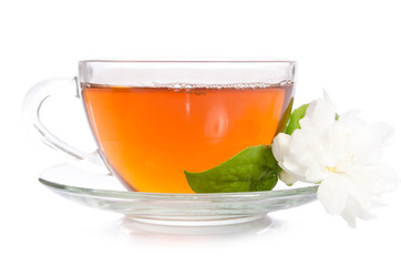 Glass cup of Tea with jasmine flowers and leaves isolated on white background
