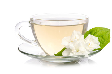 Obraz na płótnie Canvas Glass cup of Tea with jasmine flowers isolated on white background