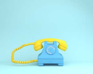 Yellow headphone against blue retro telephone on light blue color background. Concept art. minimal...
