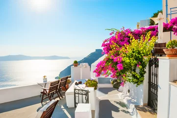 Wall murals Mediterranean Europe Beautiful terrace with pink flowers on Santorini island, Greece