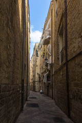 A narrow street in Bari historic centre, called in Italian "Bari Vecchia", Apulia, Italy