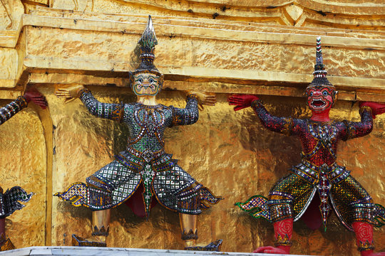 beautiful ramayana demon statue which support golden chedi building