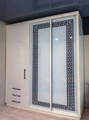 White sliding wardrobe with glass sliding doors