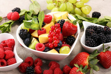 salad with fresh fruits and berries. healthy spring fruit salad