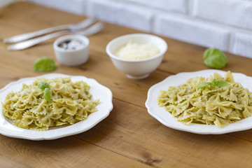 Pasta Farfalle in pesto sauce with Basil and Parmesan.