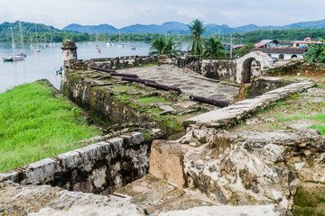 Sail boats and Fuerte Santiago fortress in Portobelo village, Panama