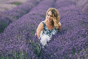 Fototapeta na wymiar Florist woman at lavender field