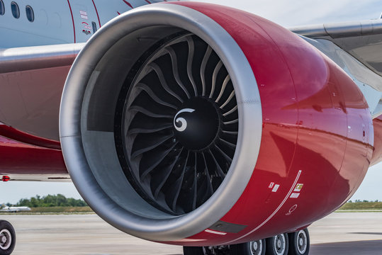 Close Up Engine Of Red Boeing 777