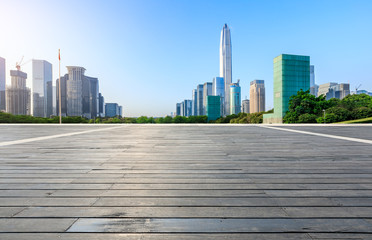 Wood floor square and modern city commercial buildings in Shenzhen