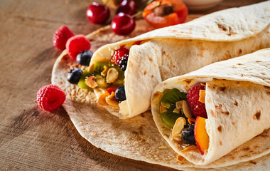 Close up on two healthy fresh fruit and nut wraps
