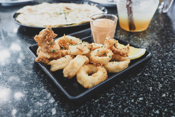 Calamari, Deep fried ring recipe with sauce and lemon.