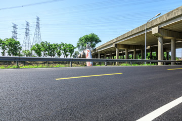 Empty asphalt highway and bridge building