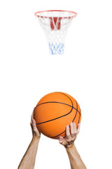 .isolated on white shooting at the basket / portrait of the arms of a basketball player intent on shooting the basket