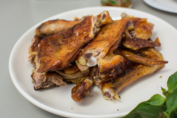 roasted chicken on wooden table,
