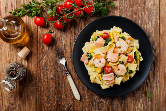 Traditional Italian fettuccini with salmon, shrimp and spinach.