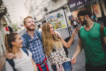 Happy group of tourists traveling and sightseeing