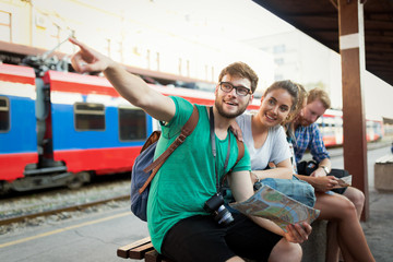 Group of friends traveling by train