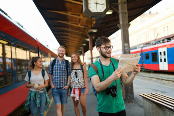 Young tourists travelling by train