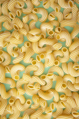 background of pasta in the form of tubes spun in a spiral