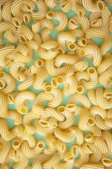 background of pasta in the form of tubes spun in a spiral