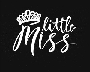 Hand lettring of phrase little miss with diadem on chalkboard.