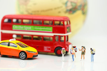Miniature people : Traveler backpacking Calling Taxi with tourist bus,Travel concept.