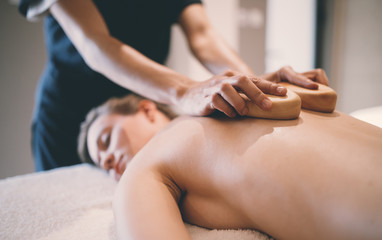 Obraz na płótnie Canvas Thai massage therapist treating patient