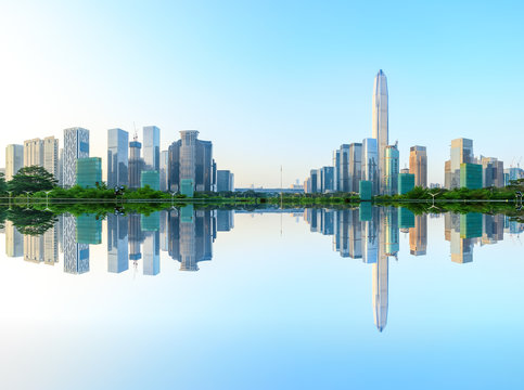 Beautiful Modern City Skyline And Water Reflection In Shenzhen At Sunrise