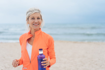 Vivacious fit woman walking on a beach