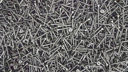 metal screw, iron screw, chrome screw, screws as a background