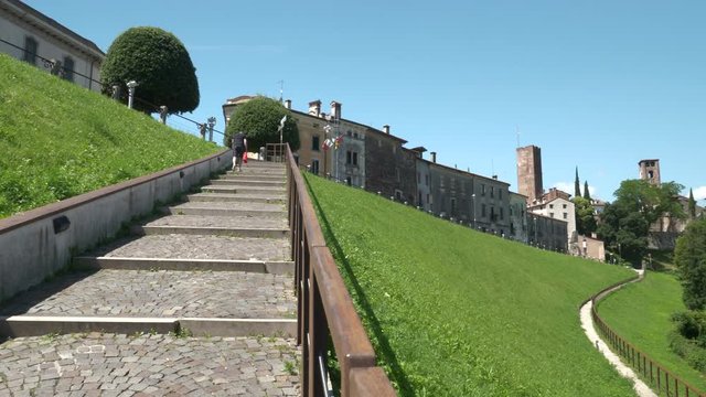View from the Gerhard Ott staircase with two people that going up to Bassano del Grappa, Italy.