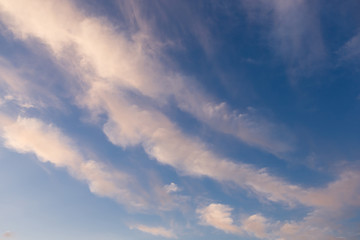 pink clouds highlighted by sunset, long clouds color gradient, abstract