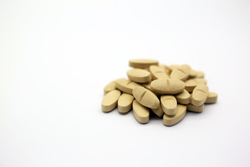 Vitamin C tablets heab isolated in white background. Pills of vitamin C.